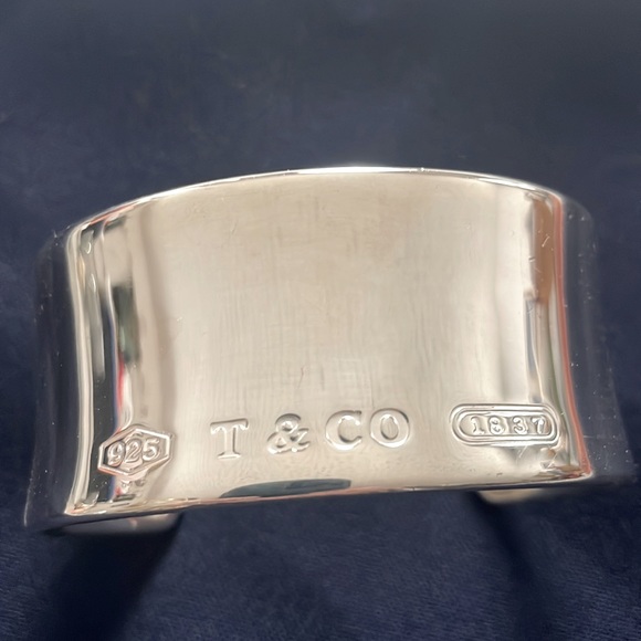 Chunky, Tiffany&Co. SS Cuff and just a tad over an inch in width.